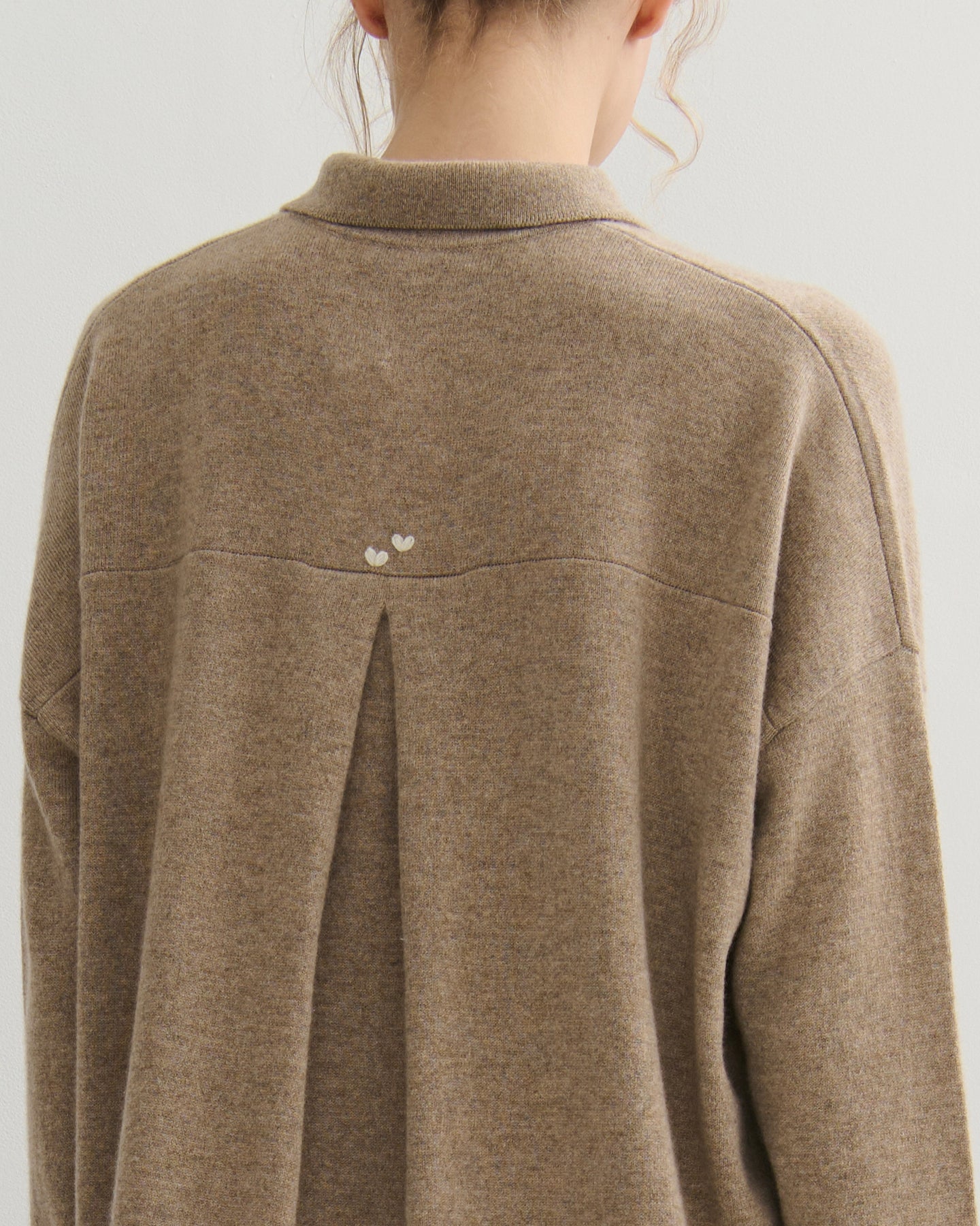 Hand-stitched heart detail on pleat back cashmere cardigan