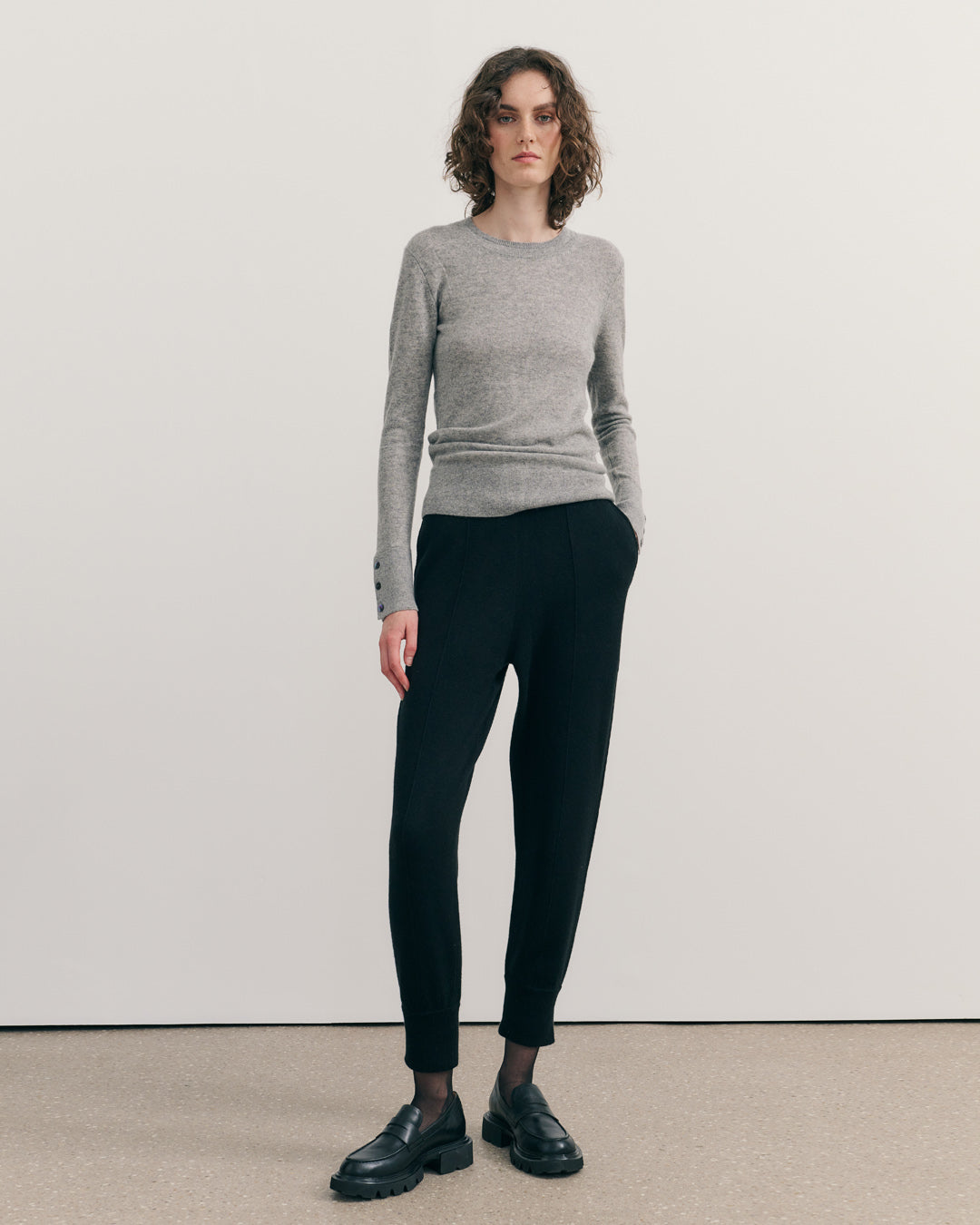 Steel grey cashmere crew neck sweater styled with tailored cashmere trousers