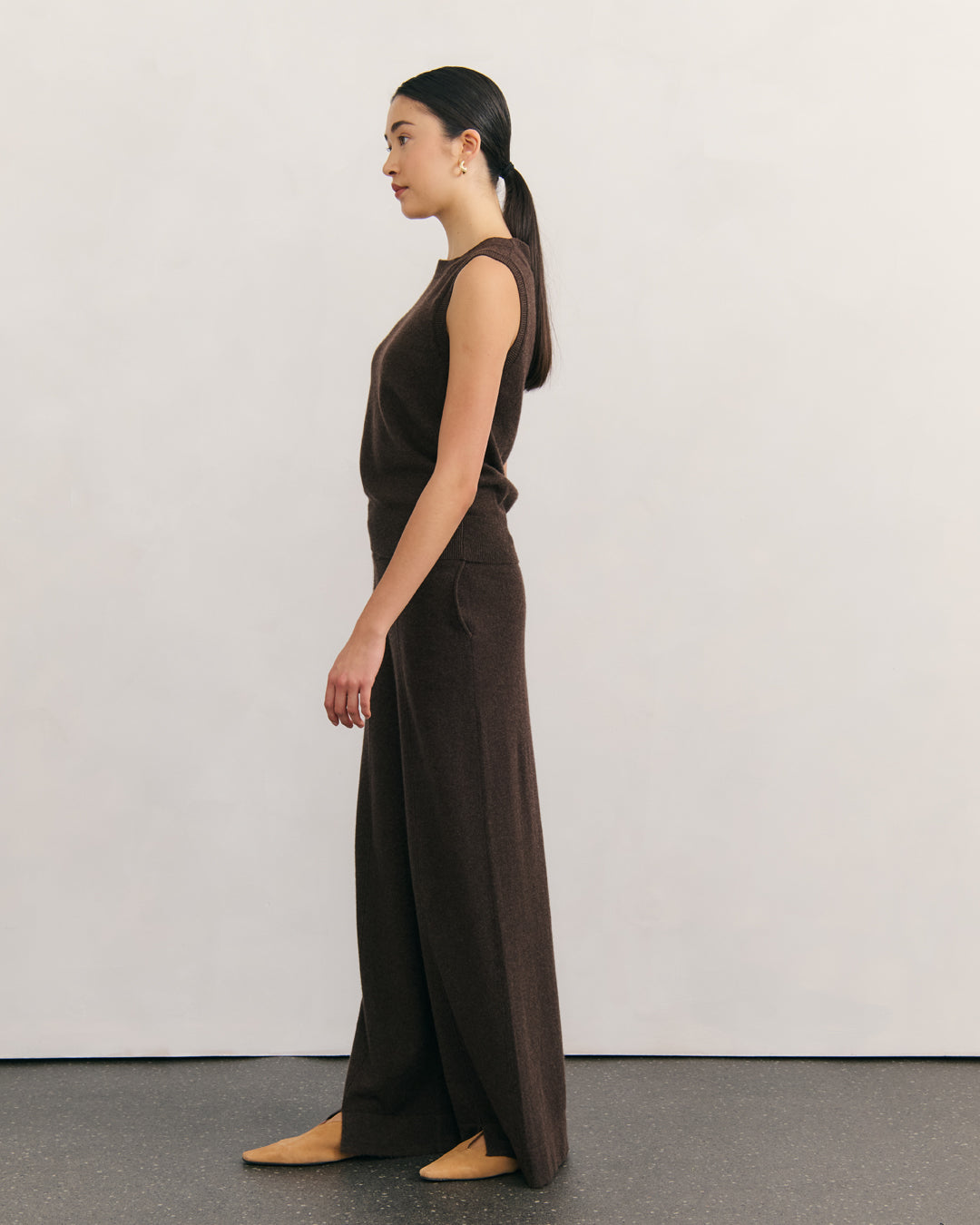 Side profile showing the relaxed drape of the chocolate cashmere power pants