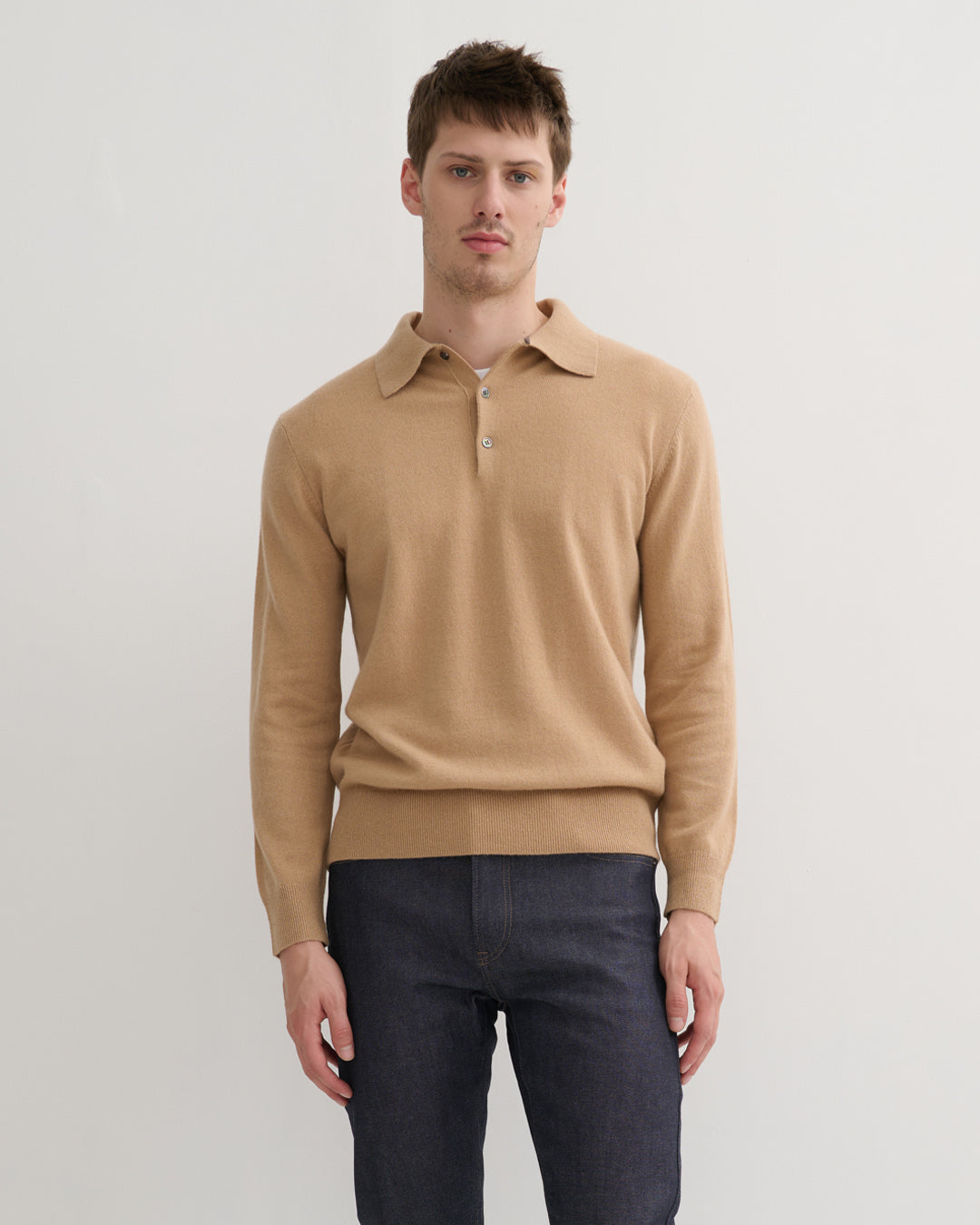 Model wearing cashmere polo style sweater in camel