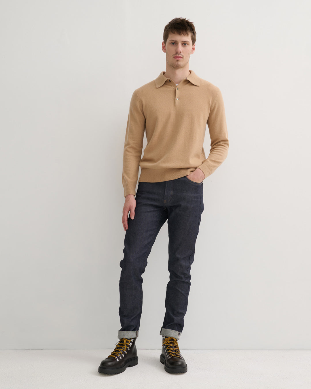 Model wearing cashmere polo style sweater in camel
