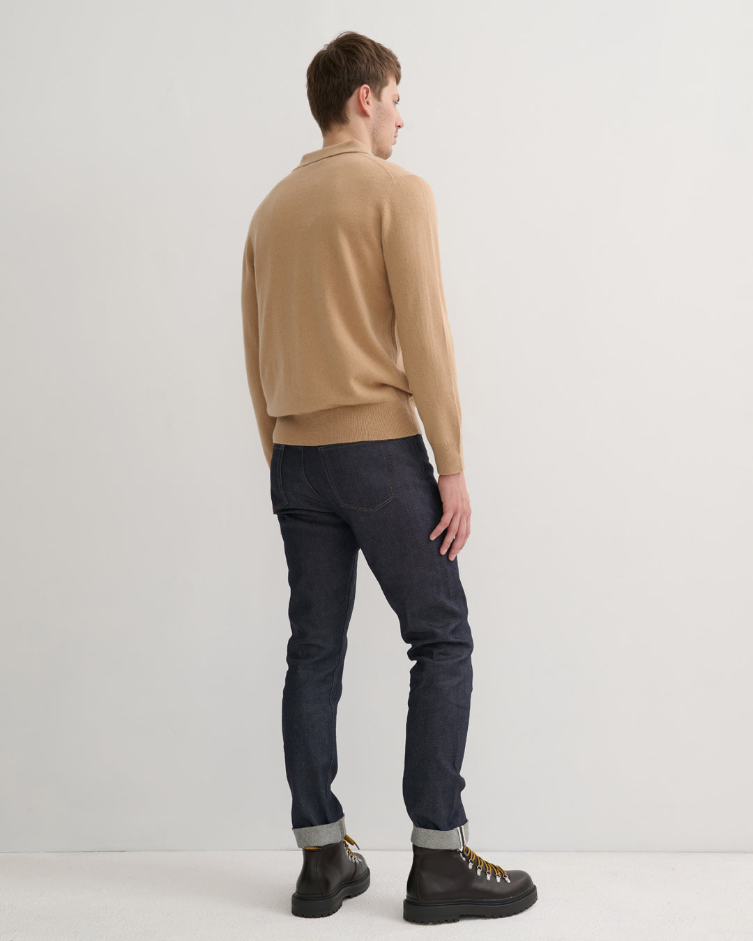 Model wearing cashmere polo style sweater in camel - Back
