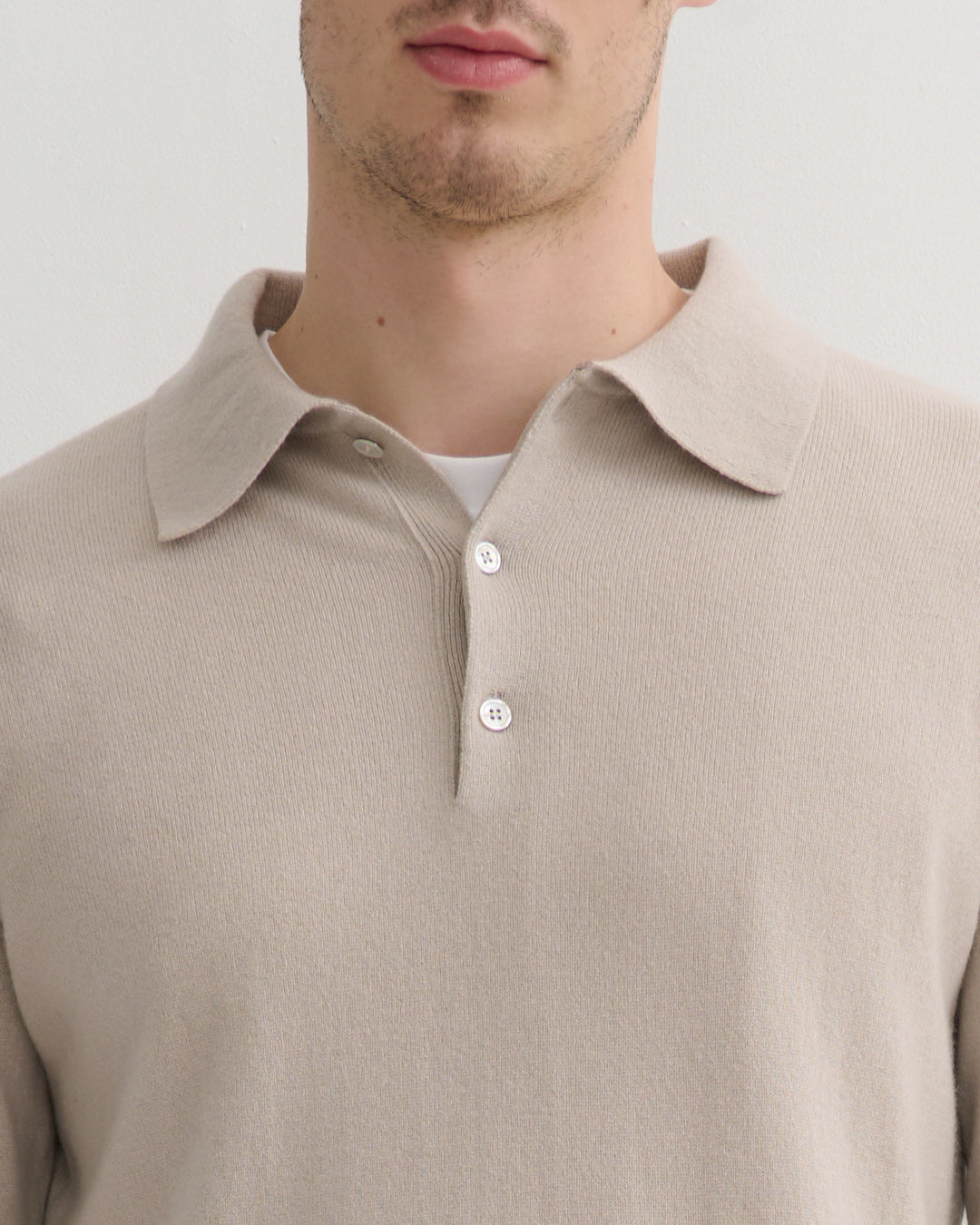 Detail view of soft collar and open placket on Ceramic Cashmere Polo