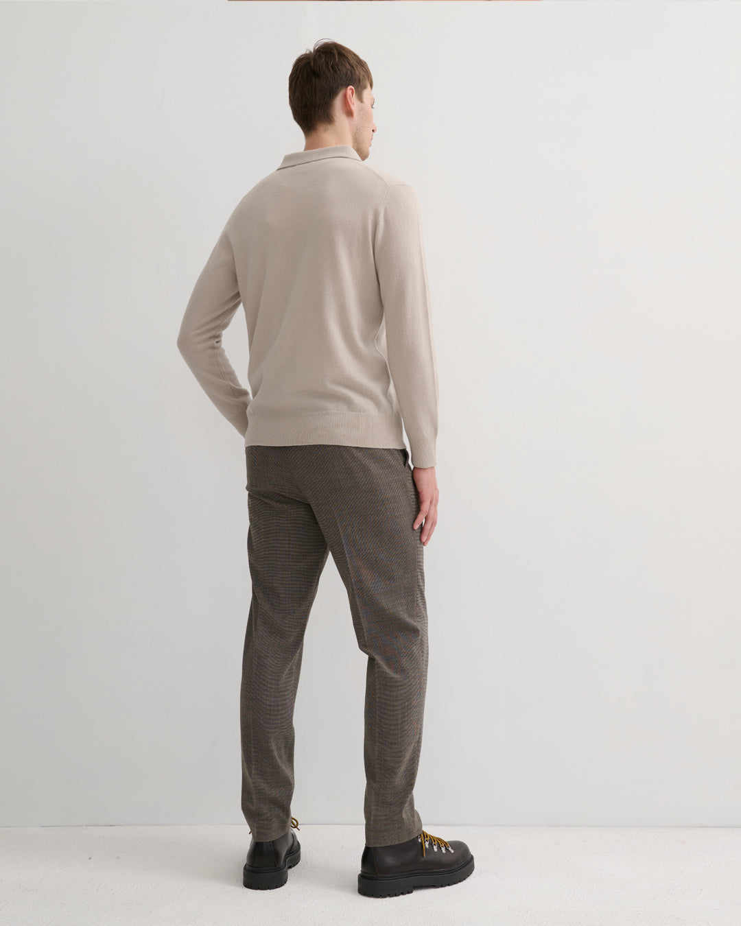 Model wearing Size L Men's Cashmere polo style Pullover in ceramic clay hue- Back profile
